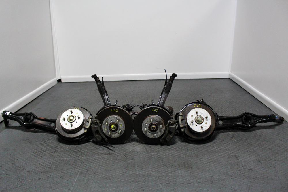 JDM Honda Del Sol 4x100 knuckles with brake calipers.