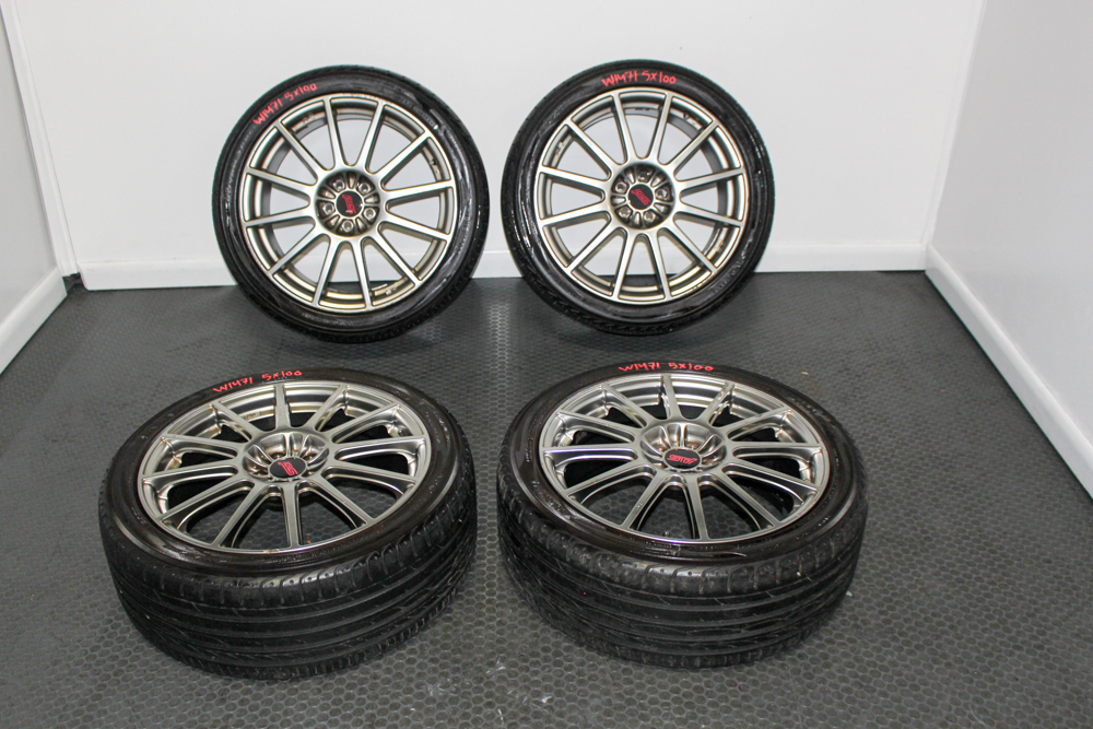 Genuine JDM Subaru STI Spec C Enkei wheels 18x7.5 +55 5x100. Lightweight OEM performance rims in clean condition at J-Spec Auto Sports.