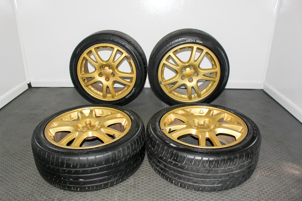 Subaru WRX STI Version 7 gold wheels OEM STI V7 17x7.5 gold rims Subaru STI wheels Brembo brake clearance JDM Subaru STI 10 spoke gold wheels Subaru WRX STI OEM gold wheel set
