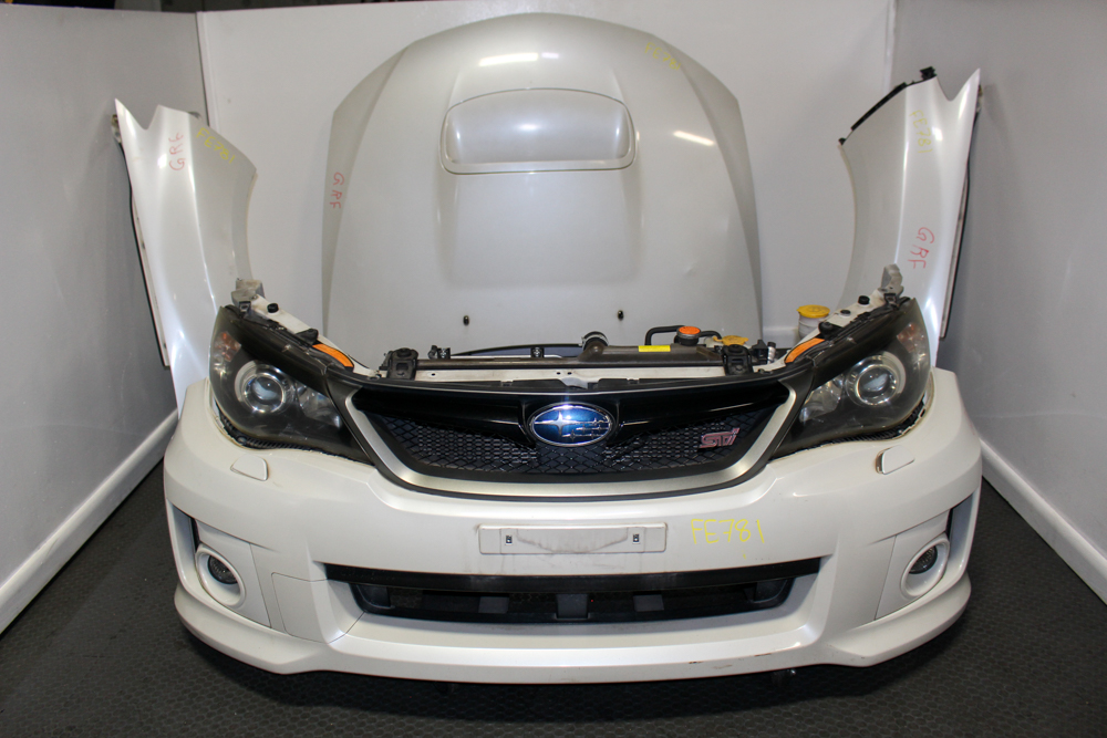 JDM Subaru WRX STI GRF front end conversion with OEM HID headlights, STI front bumper with lip, STI grille, aluminum hood with hood scoop, fenders, and radiator support from J-Spec Auto Sports