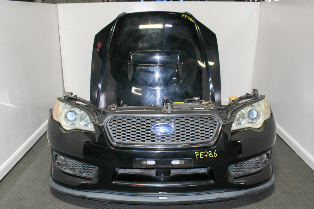 Used JDM Subaru Legacy Spec B BP5 black front end conversion with OEM HID headlights, aluminum hood with hood scoop, STI grille, rare STI front lip, fog lights, bumper cover, fenders, and radiator support from J-Spec Auto Sports
