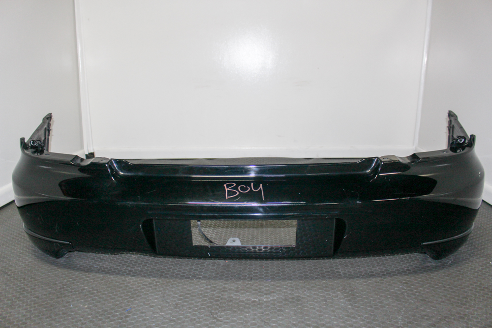 Used JDM 2005–2007 Subaru WRX STI rear bumper cover 57704FE260 in black with side spats